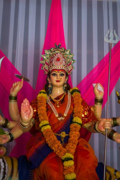 Durga idol adorned with marigold garlands during Dussehra celebrations
