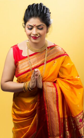 Woman dressed in a festive silk saree celebrating Dussehra