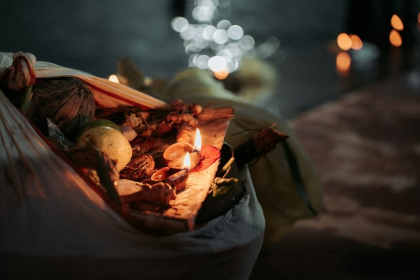 A bag of fruit and prasad offerings for Chhath Puja sitting on a table